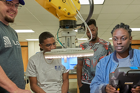 student studying in dorm housing