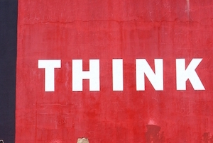 the words 'think' white letters on red background