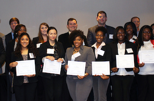 group of students holding certificates
