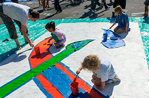 children painting canvas