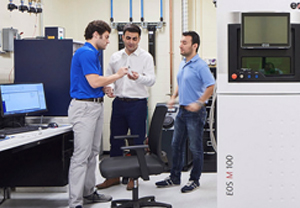 engineering lab manager assisting lab workers