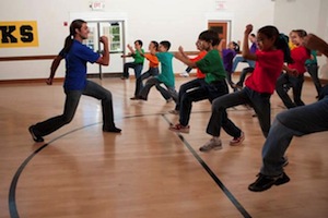  physical education faculty leading exercise student group