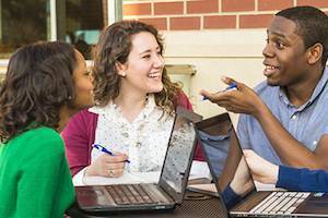 three students studying