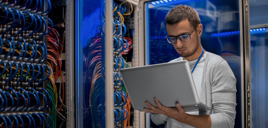 undergraduate IT student in server room